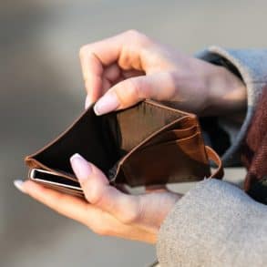 woman showing empty wallet