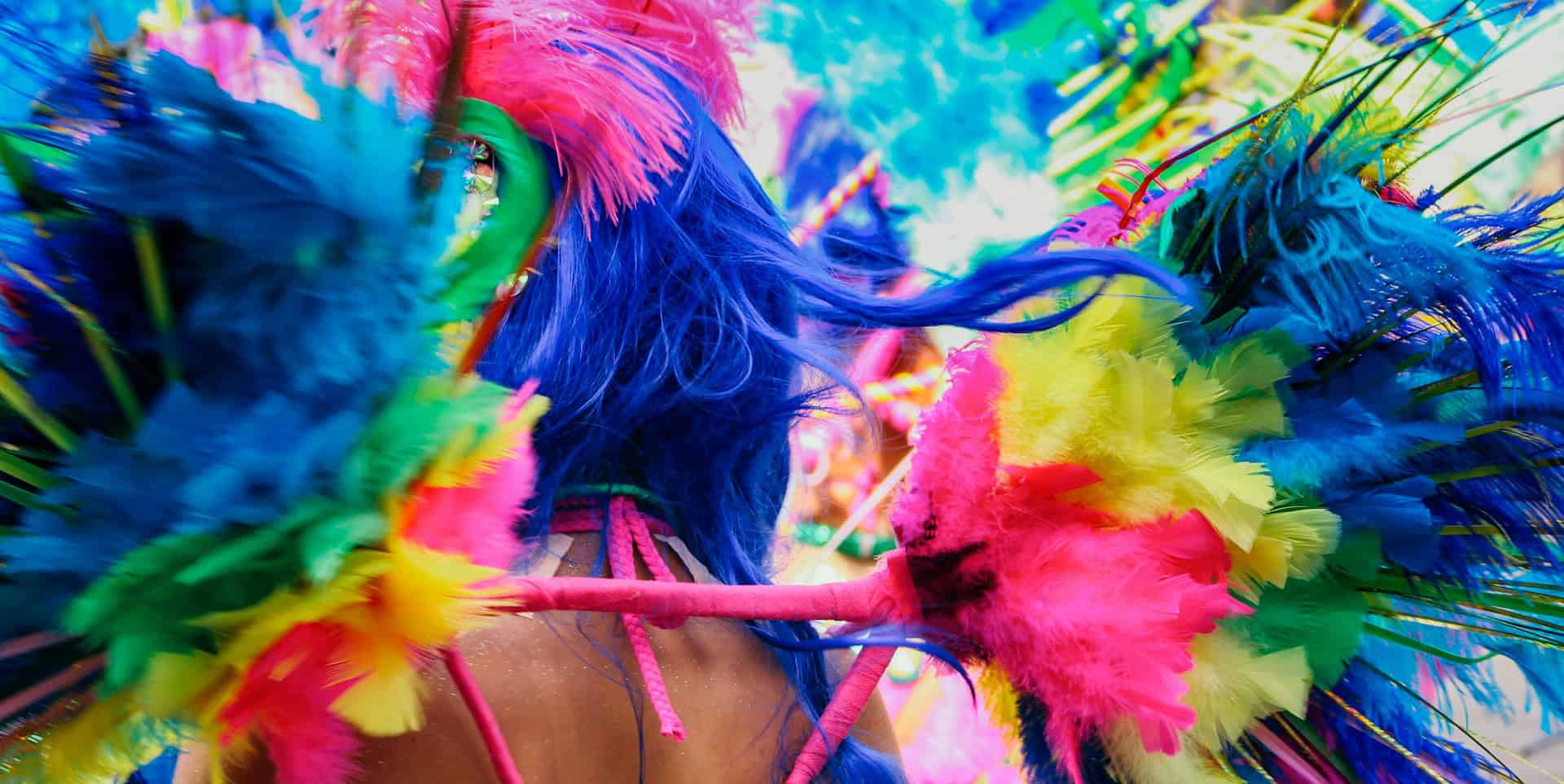 A woman dressed in extravagant carnival outfits