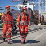 Two air ambulance crew walking away from the air ambulance helicopter