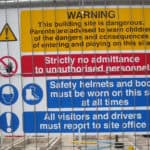 Building site with warning sign