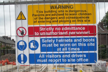 Building site with warning sign