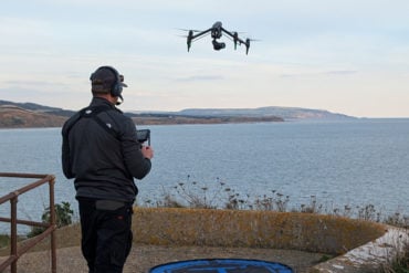 Drone operator shooting the new sky mobile tv advert on the Military Road