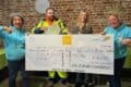 Yetta Elkins and others with giant cheque from Isle of Wight Foundation