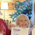 Oakfield pupils with PSQM award certificate