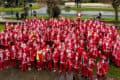 Aerial shot of all the participants dressed in Santa outfits