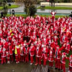 Aerial shot of all the participants dressed in Santa outfits