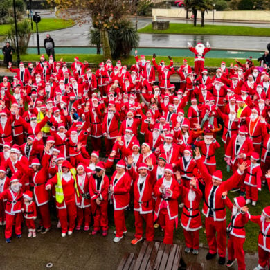 Aerial shot of all the participants dressed in Santa outfits