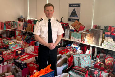 Scott Chilton with all of the presents