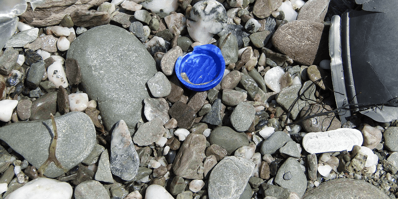 Smarties Lid on a beach in Cornwall