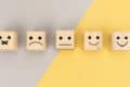 Wooden blocks with range of emoji faces on them