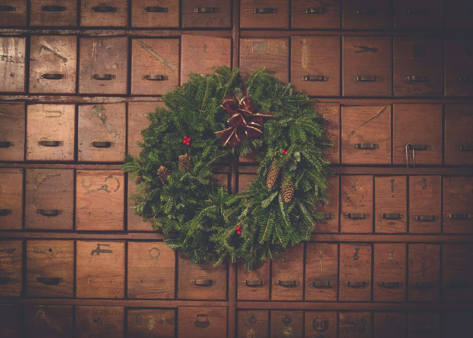 christmas wreath on a background of wooden drawers