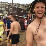 Bare topped man taking part in boxing day swim