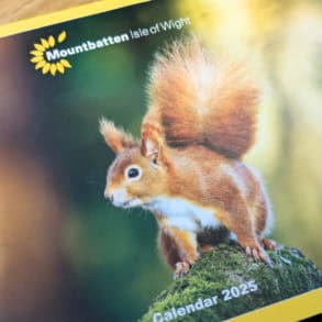 Front cover of 2025 calendar with picture by Ian Groves of a Red Squirrell