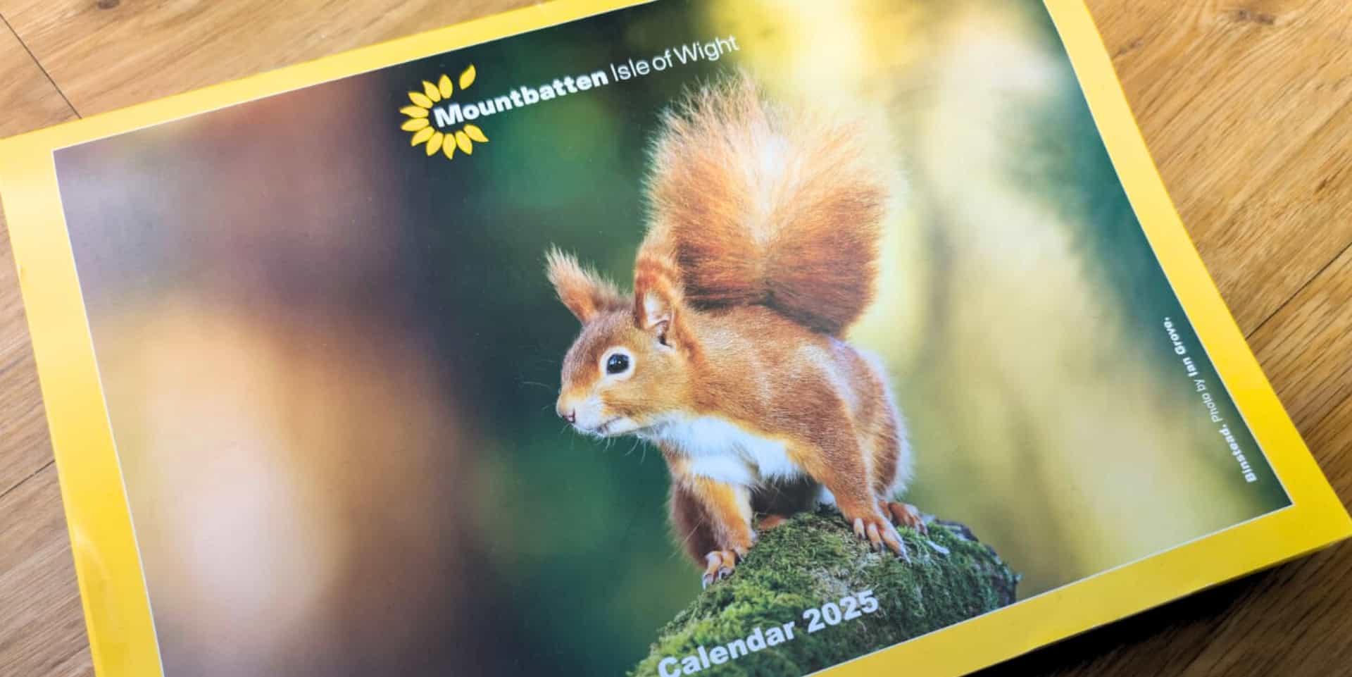 Front cover of 2025 calendar with picture by Ian Groves of a Red Squirrell