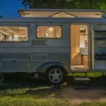 Caravan with lights on and door open