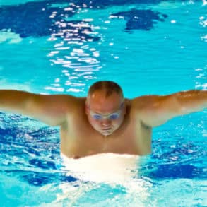 Person swimming in a pool