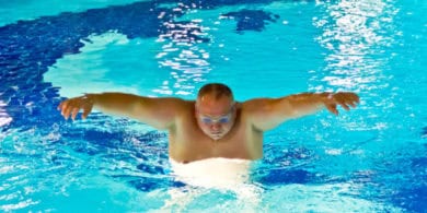 Person swimming in a pool