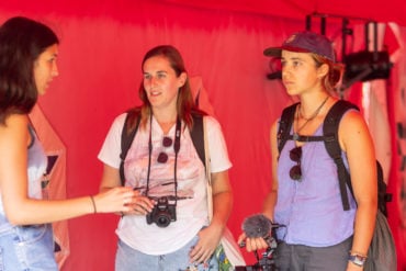 Two volunteers filming at the Fringe festival