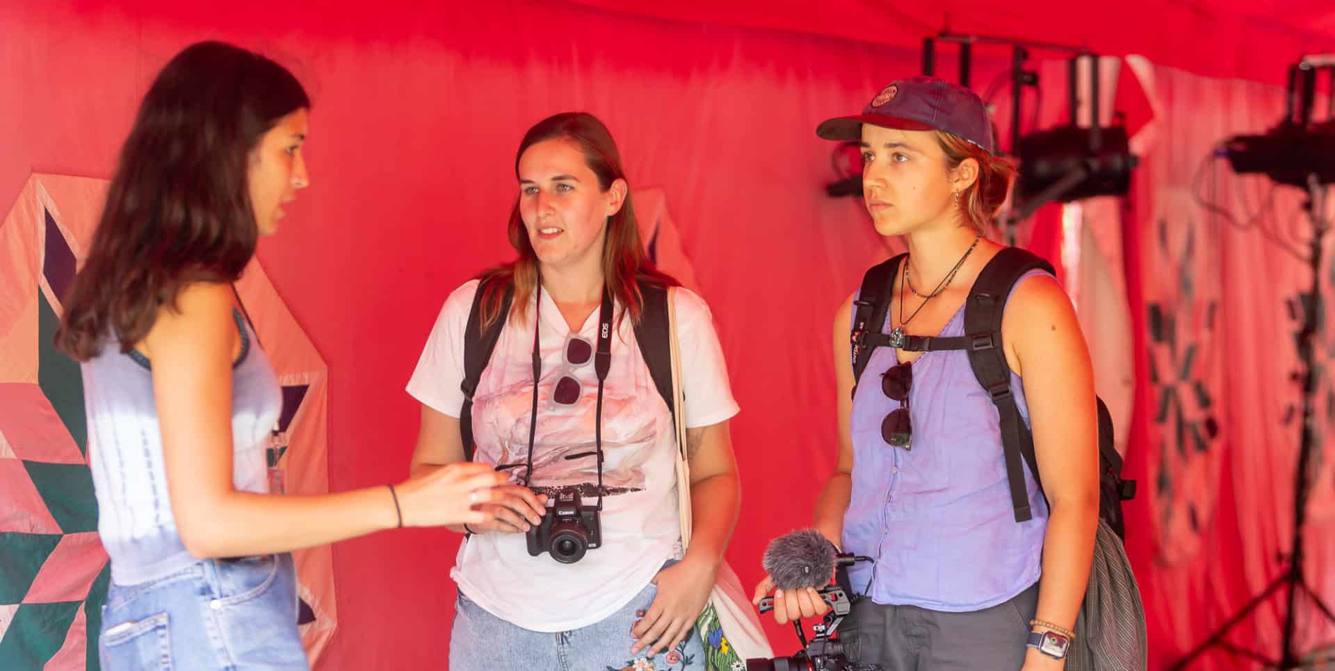 Two volunteers filming at the Fringe festival