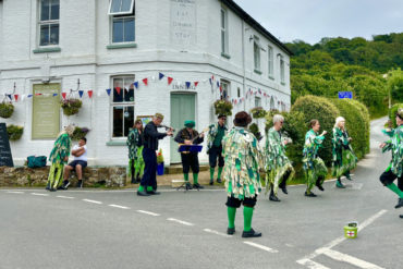 Mr Bakers Dozen morris side dancing at The Highdown 2024