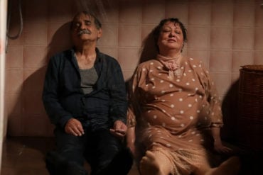 Scene from 'My Favourtie cake' showing two older characters with their feet up