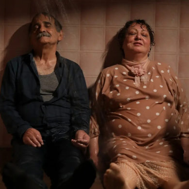 Scene from 'My Favourtie cake' showing two older characters with their feet up