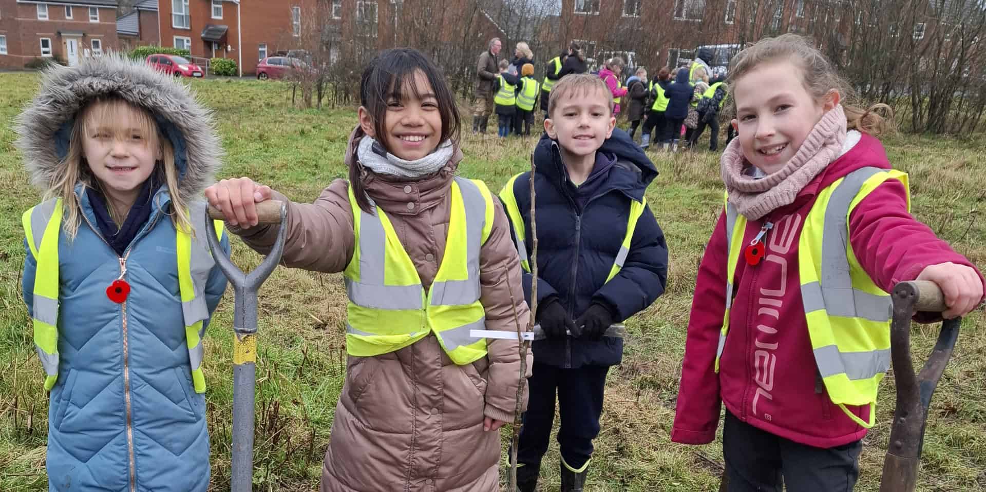 Children planting trees in Pan Community Park