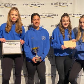 Young sporting stars with their awards