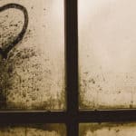 love heart marked into dust on window of derelict property by gaelle marcel