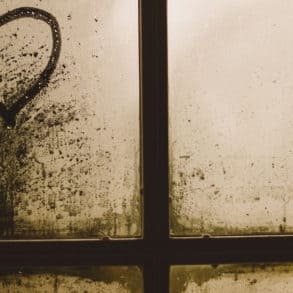 love heart marked into dust on window of derelict property by gaelle marcel