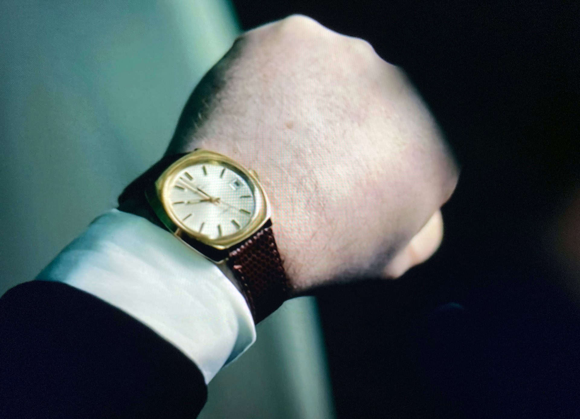 person looking at wrist watch by claus friede