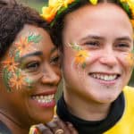 Two women smiling at the camera whilst taking part in Walk the Wight