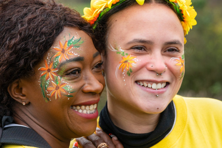 Two women smiling at the camera whilst taking part in Walk the Wight