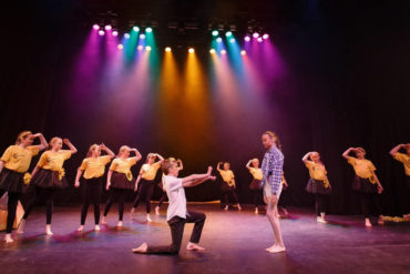 Arreton primary pupils performing on stage