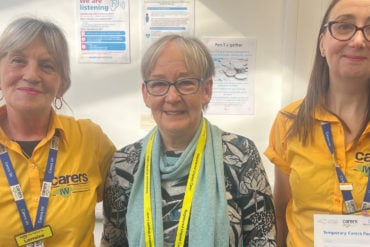 Three carers with their temporary carers passports