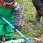 Child and granddad working on Gurnard community farm