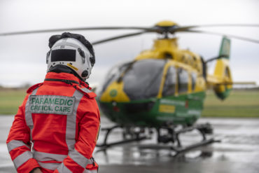 Paramedic standing by the air ambulance