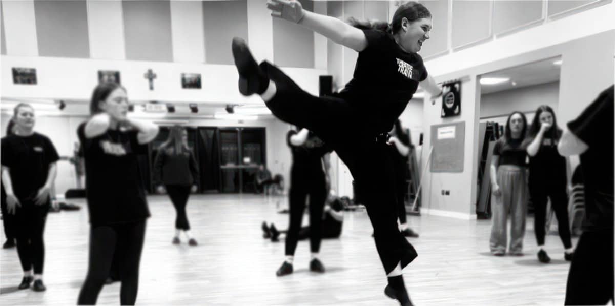 Theatretrain girls rehearsing and jumping high