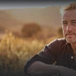 Ben fogle sitting in the countryside