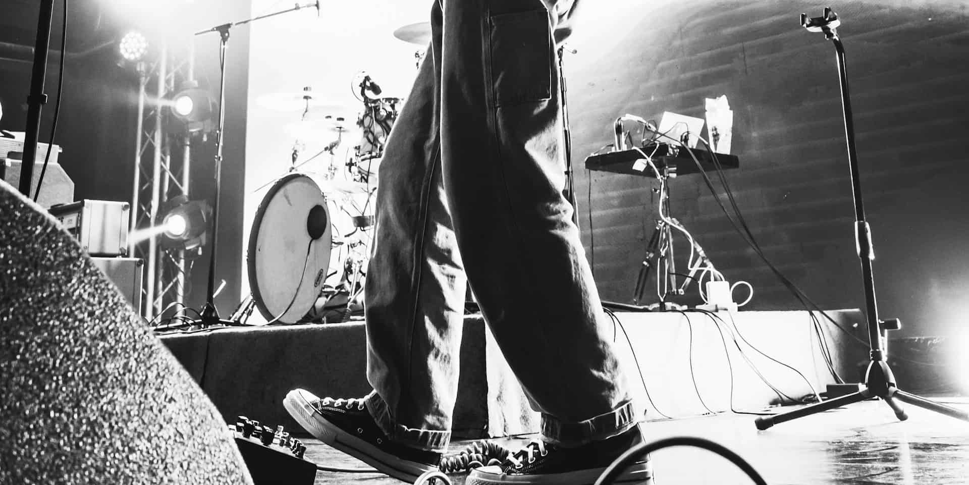 black and white photo of guitarist on stage