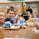 children eating breakfast at school