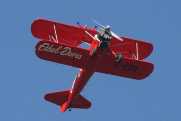 ethel dares plane in the sky with someone wing walking