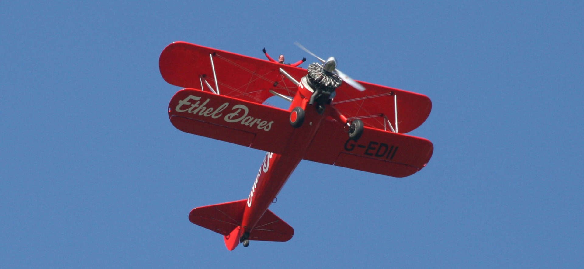 ethel dares plane in the sky with someone wing walking