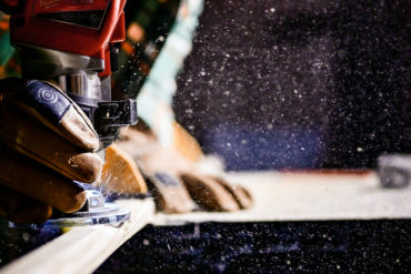 man holding power tool for carpentry work