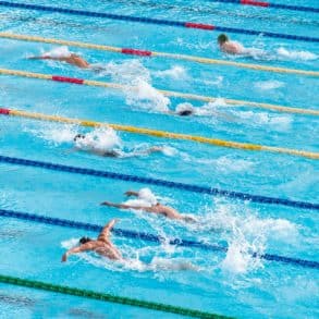 men competing in swimming competition