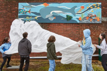 Arts Lab participants unveiling with their mural