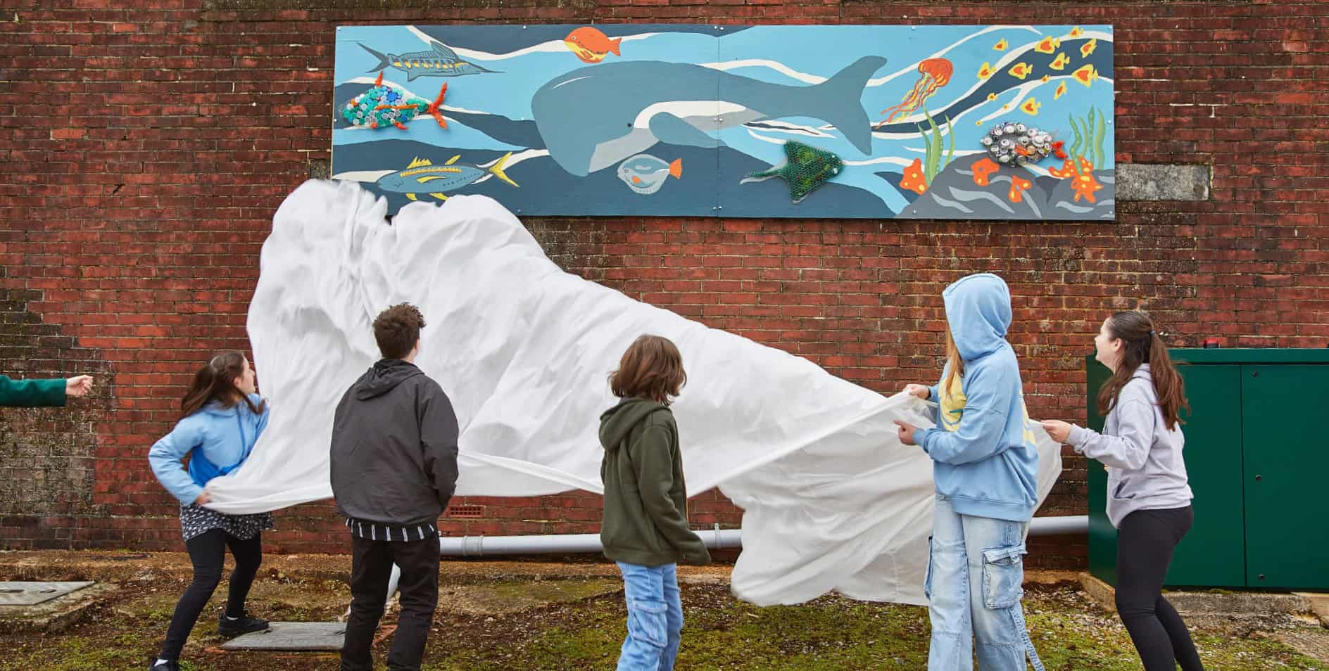 Arts Lab participants unveiling with their mural