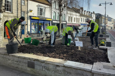 The students carrying out gardening work in Newport town square