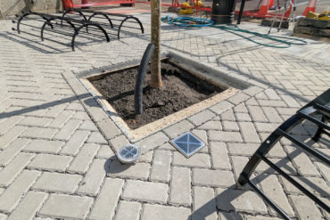 The new paving outside county hall with drains into the SUDS system