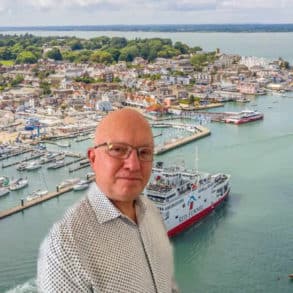 Neil Chapman portrait on background image of Red Funnel ferry leaving Cowes